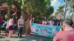 Bhabinkamtibmas Desa Tibusisok Polsek Janapria Kawal Karnaval Meriah di Janapria
